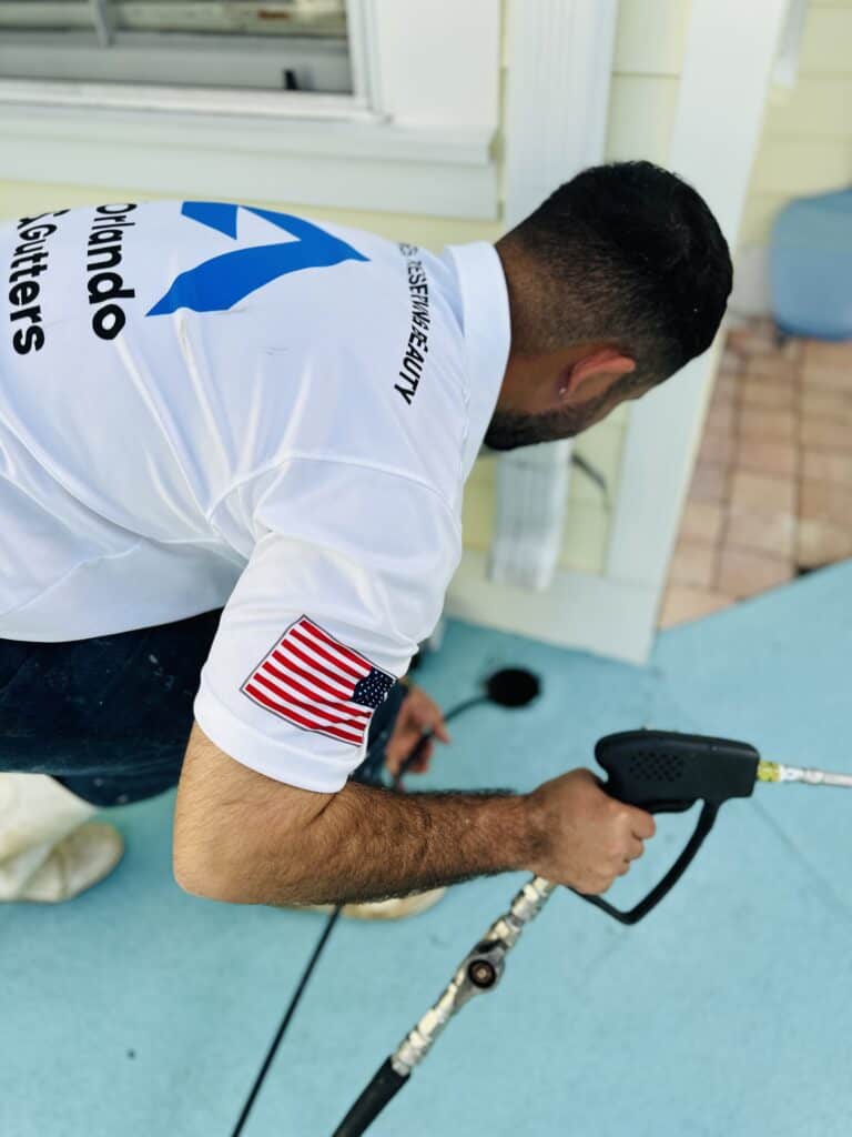 Man cleaning out a French drain